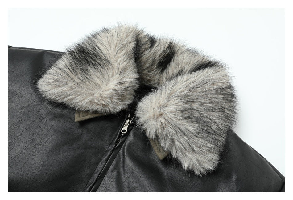 Close-up of the jacket’s fluffy gray-and-black collar, olive collar points, and zipper.