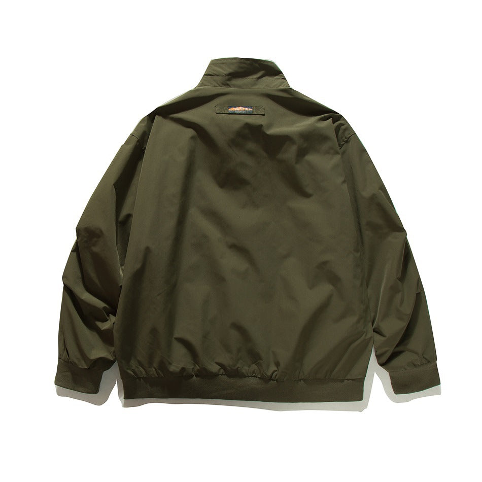 Army green stand-collar jacket flat lay, back view with small label at the back neck and ribbed hem