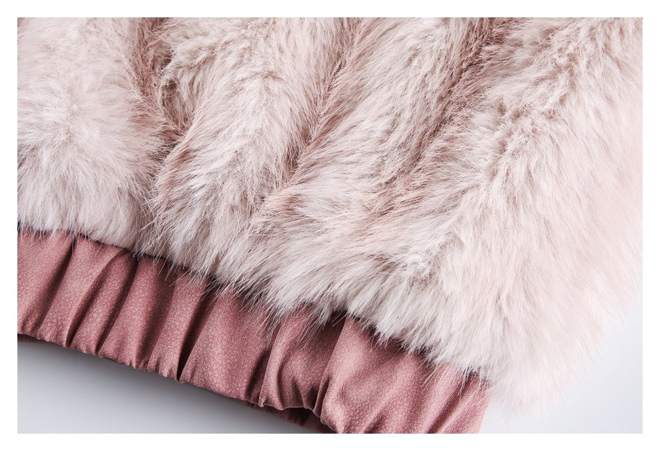 Close-up of pale blush faux fur above the jacket's gathered dusty-rose hem.