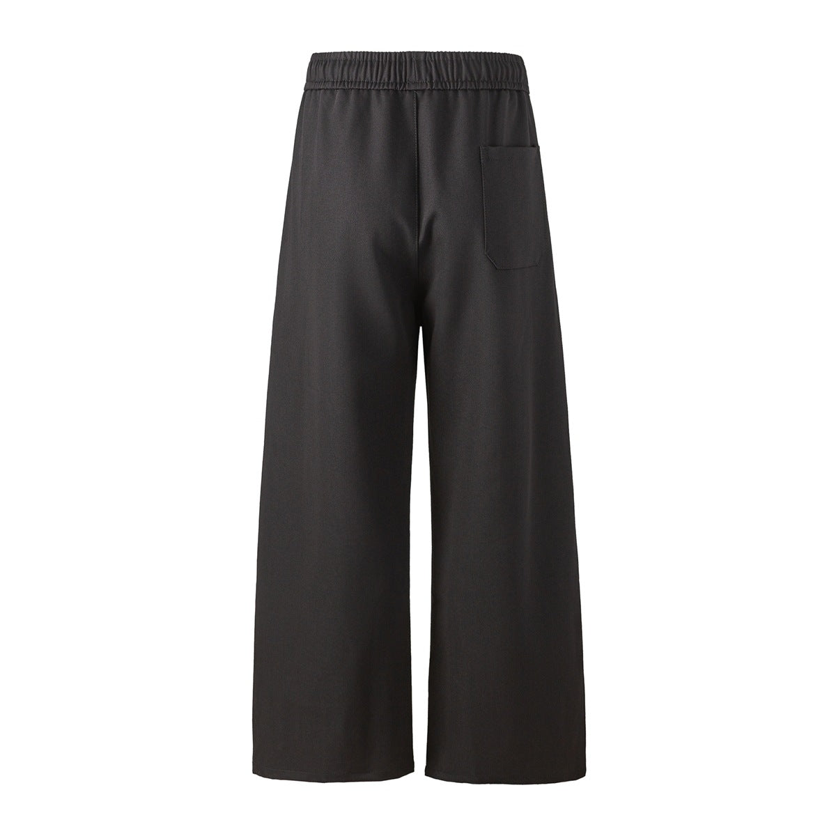 Back view of dark wide-leg trousers with an elastic waistband and a single patch pocket.