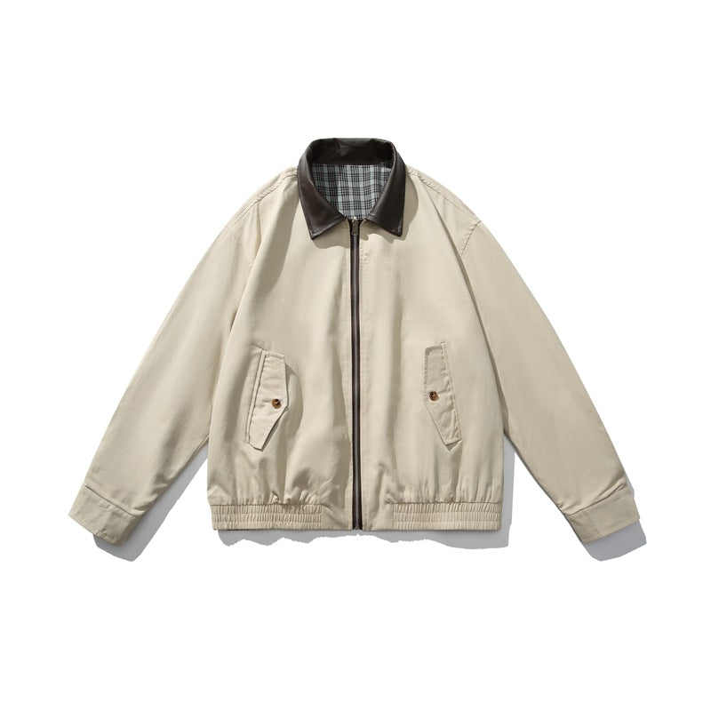 Khaki zip-front jacket with dark brown collar, plaid collar underside, flap pockets and elastic hem, flat lay