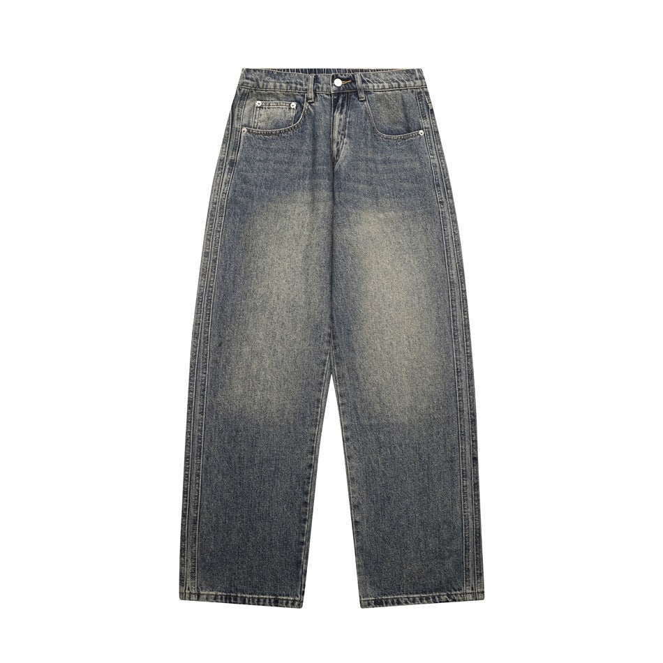 Flat-lay front of men's wide straight-leg jeans in faded gray-blue wash with whiskering and rivet pockets