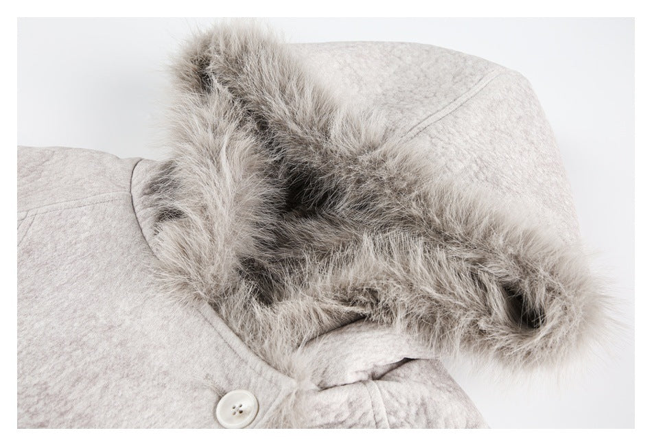Close-up of the light gray jacket hood, showing its thick fur trim, hood seam, and button fastening.