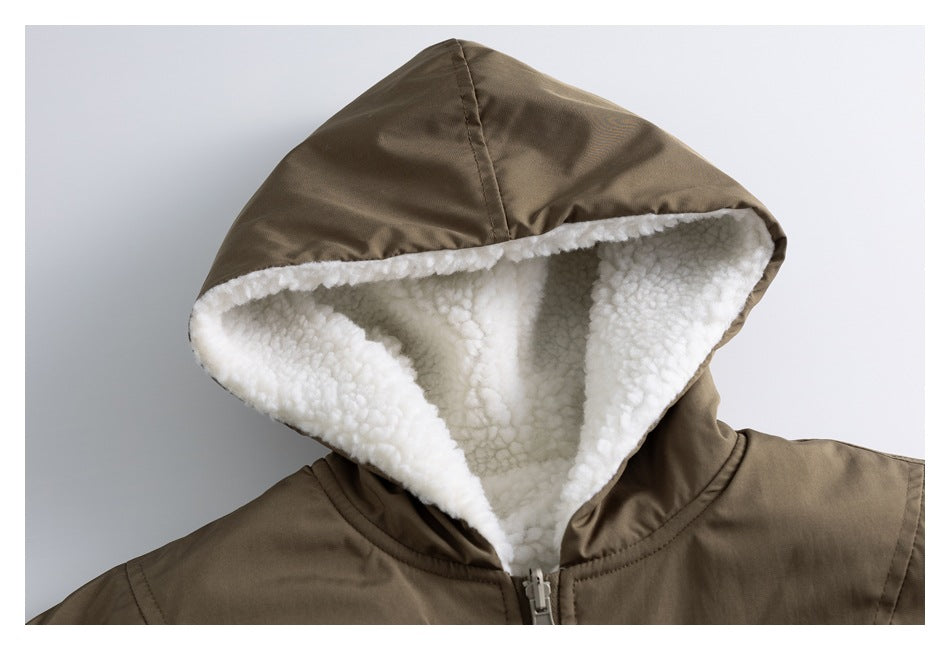 Close-up of a brown jacket hood with white sherpa lining and a front zipper.