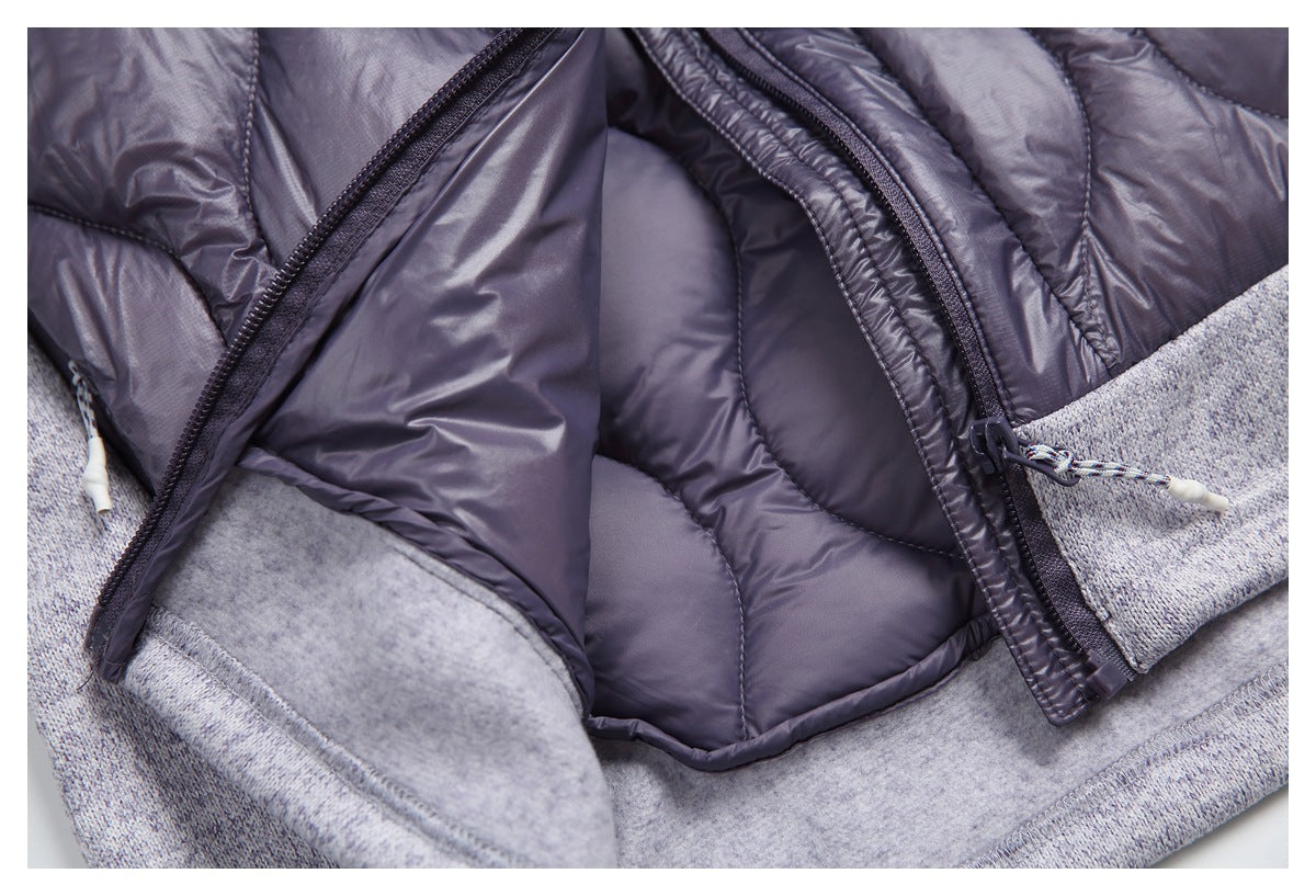 Open jacket close-up showing dark lining, front zipper tracks, corded pulls, and gray heather fabric.