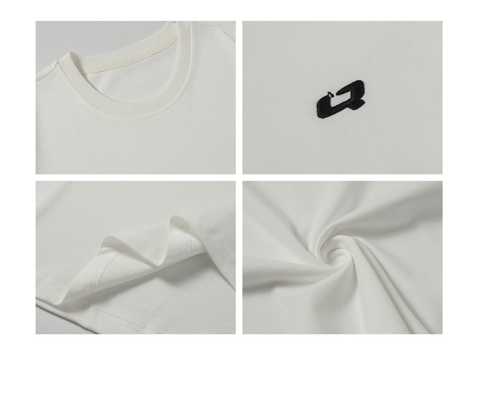 Four close-ups of a white T-shirt showing its crew neck, black embroidered chest emblem, hem stitching, and fabric folds.