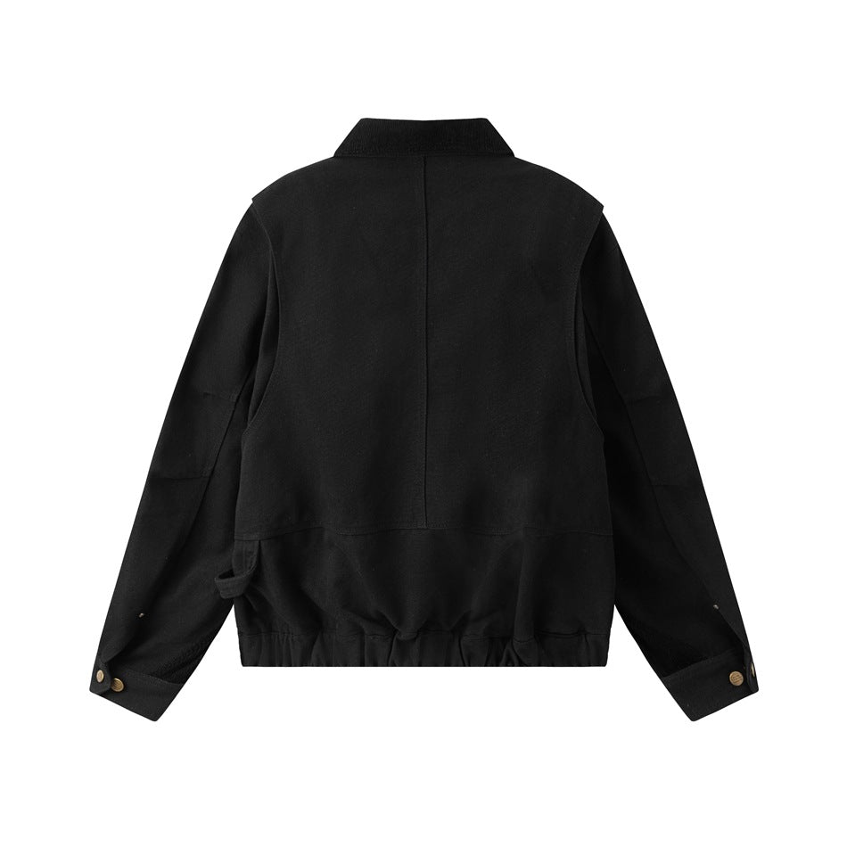 Back view of a black jacket laid flat, showing a collared neckline, center seam, gathered hem, and buttoned cuffs.