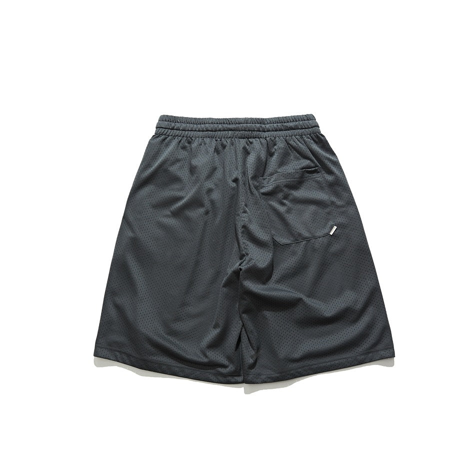 Dark gray perforated mesh shorts, back flat view showing elastic waistband and a back pocket