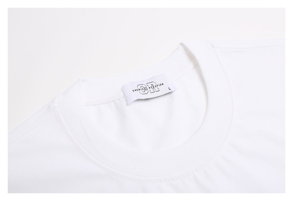 Close-up of the white T-shirt's ribbed crew neck and sewn-in label.