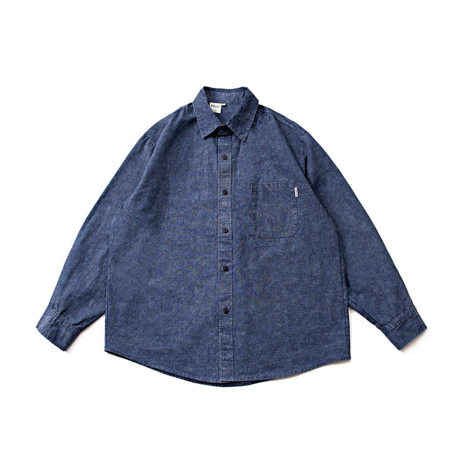 Blue washed long-sleeve button-up shirt with chest pocket, flat lay front view