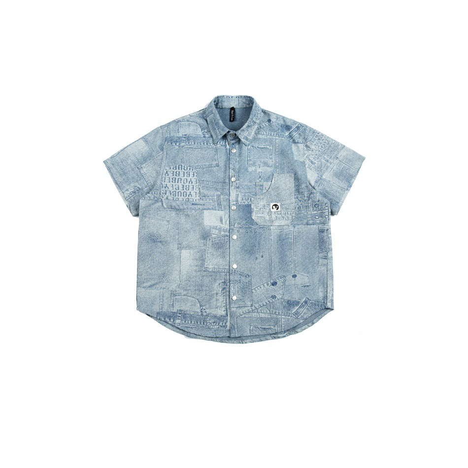 Light blue short-sleeve shirt with faded jeans-style patchwork print, snap front, collar and chest pocket, flat lay