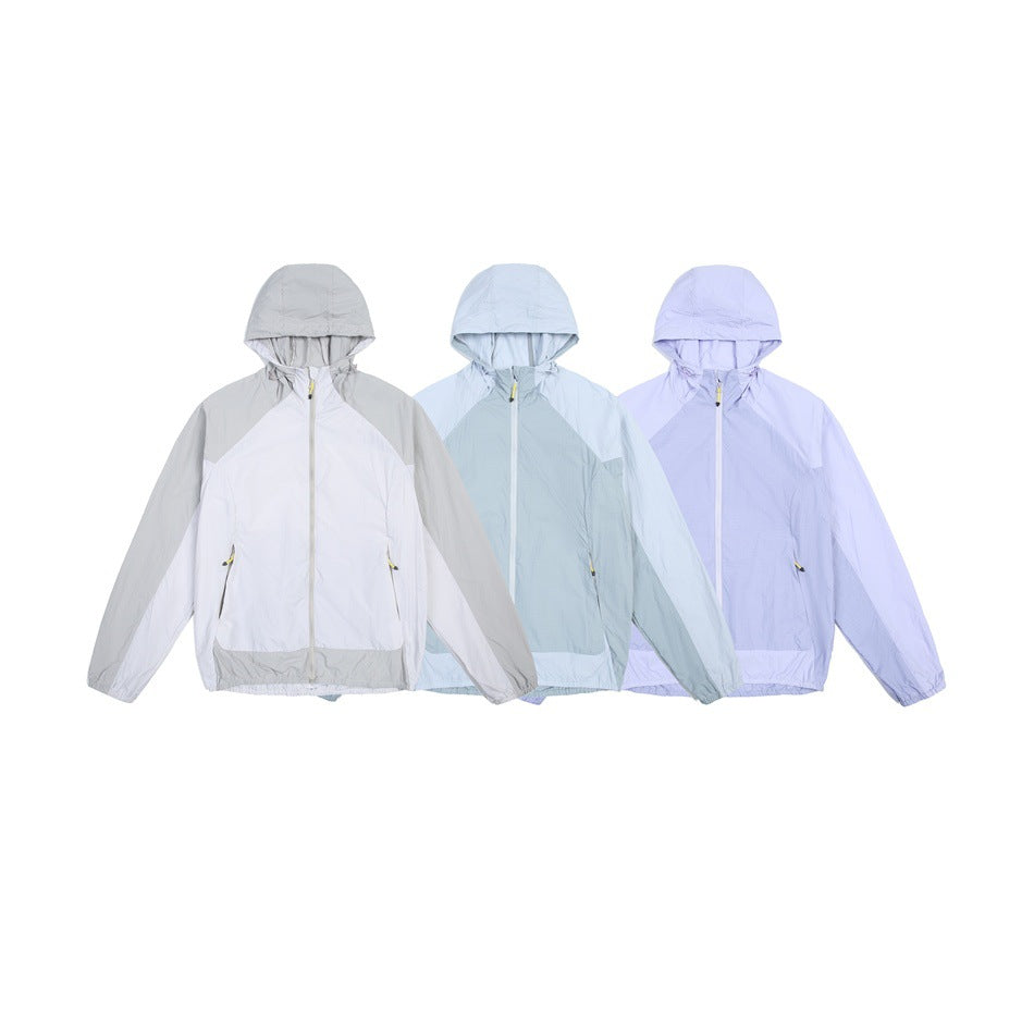 Three hooded zip jackets displayed together in gray and white, pale blue, and lavender colorways.