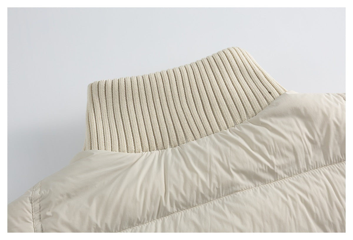 Close-up of the cream vest's tall ribbed knit collar and quilted upper back.