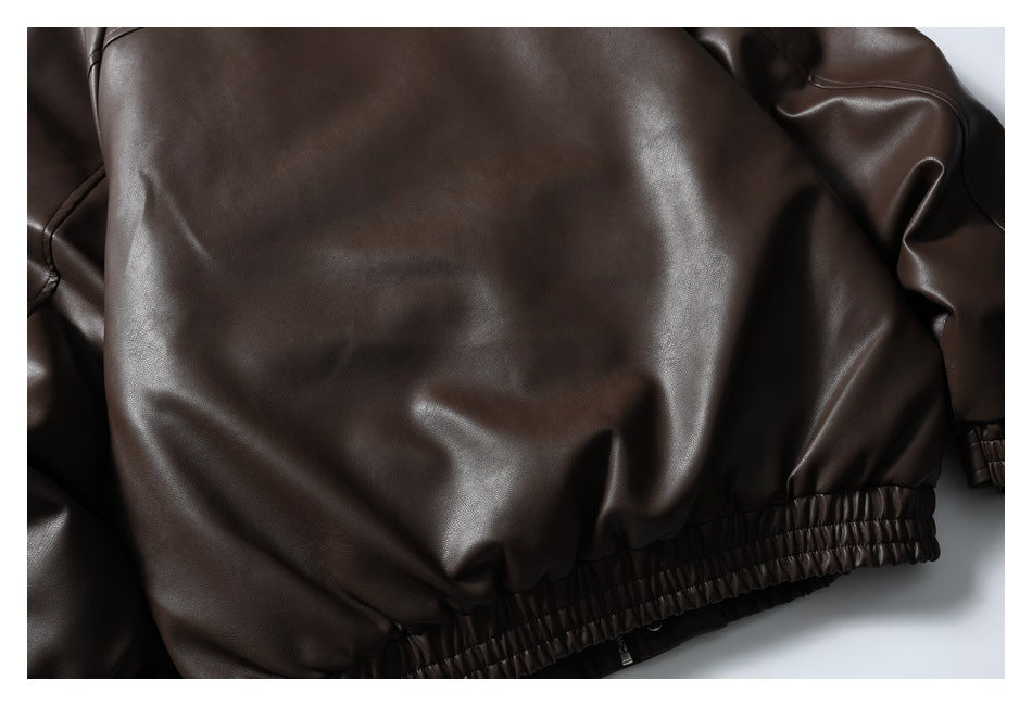 Close-up of the dark brown jacket's smooth back panel and gathered elastic hem.
