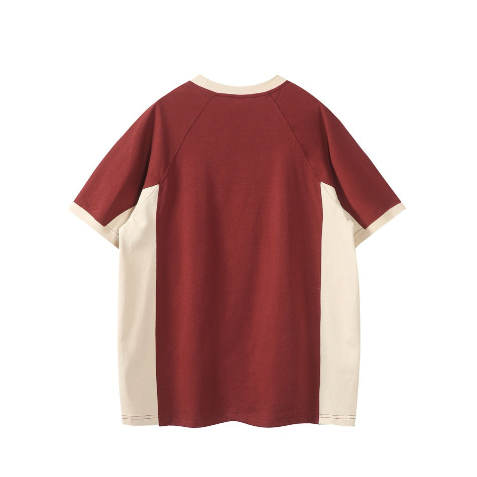 Back view of a short-sleeve burgundy shirt with cream side panels, collar trim, and sleeve cuffs.