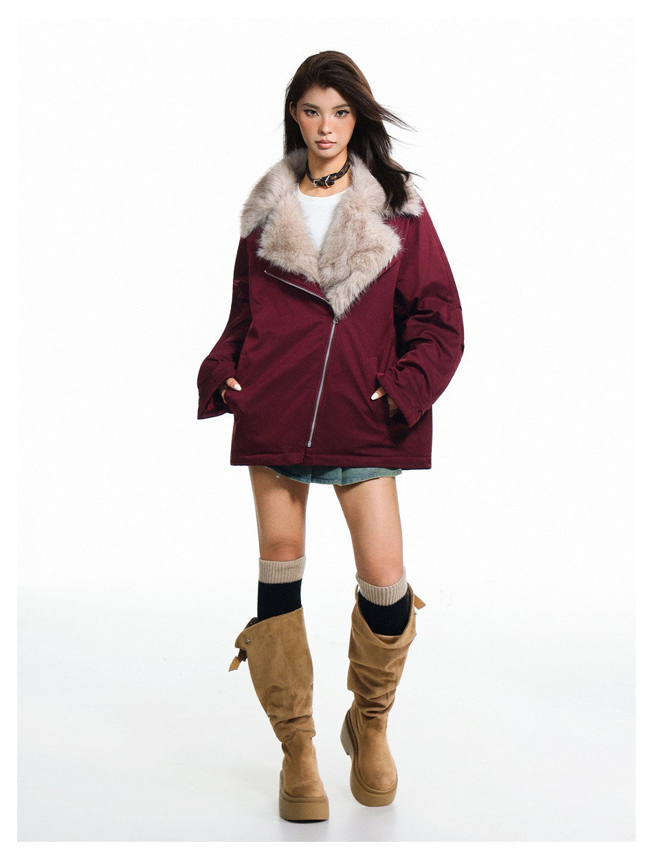Full-length model wearing a burgundy jacket with a light plush collar and diagonal zipper.