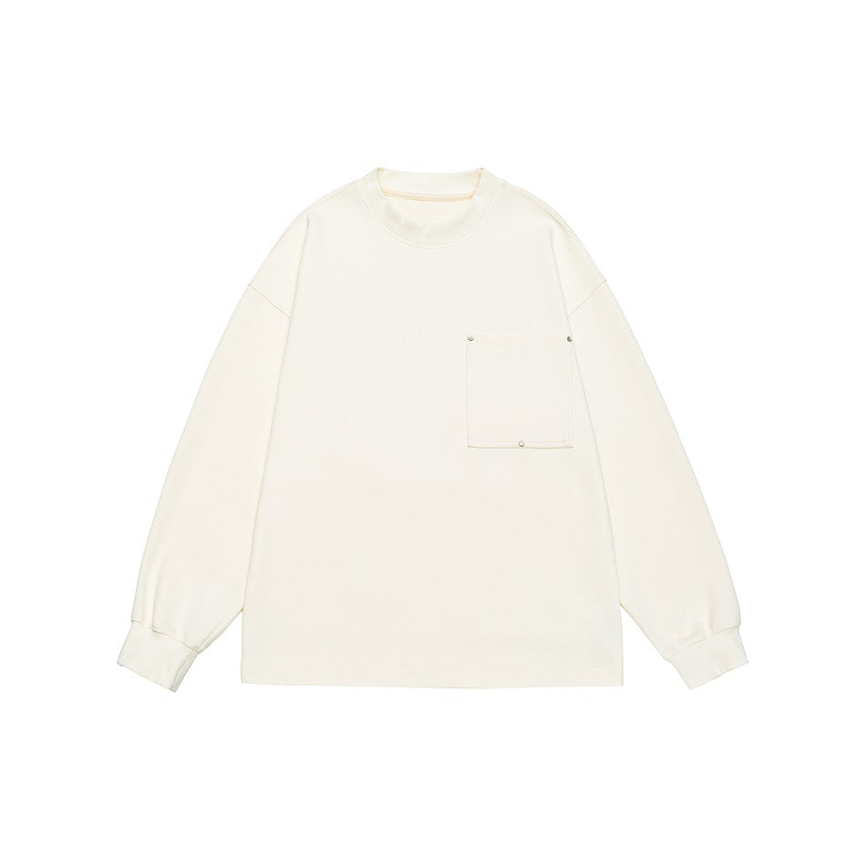 Beige long-sleeve crew neck sweatshirt flat lay with square chest pocket and metal studs