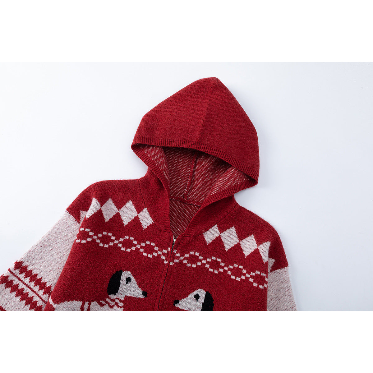 Close front view of a red hooded knit cardigan with cream geometric bands and dog motifs.