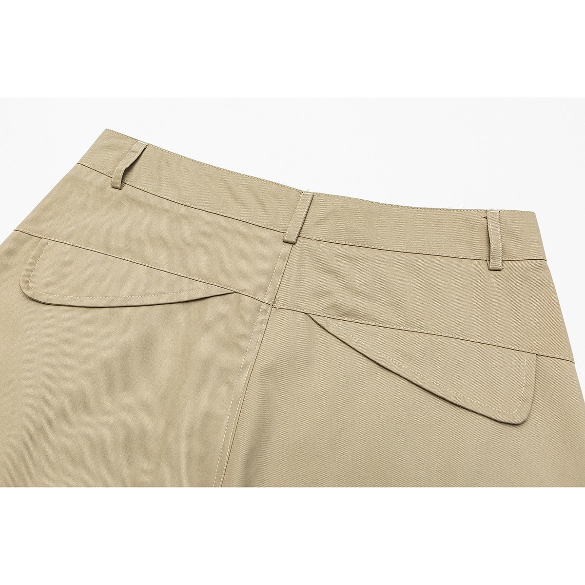 Close-up of the back waistband and flap pockets on beige trousers.