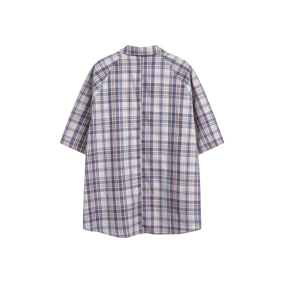 Back view of a pale plaid short-sleeve button-up shirt with a straight center seam.