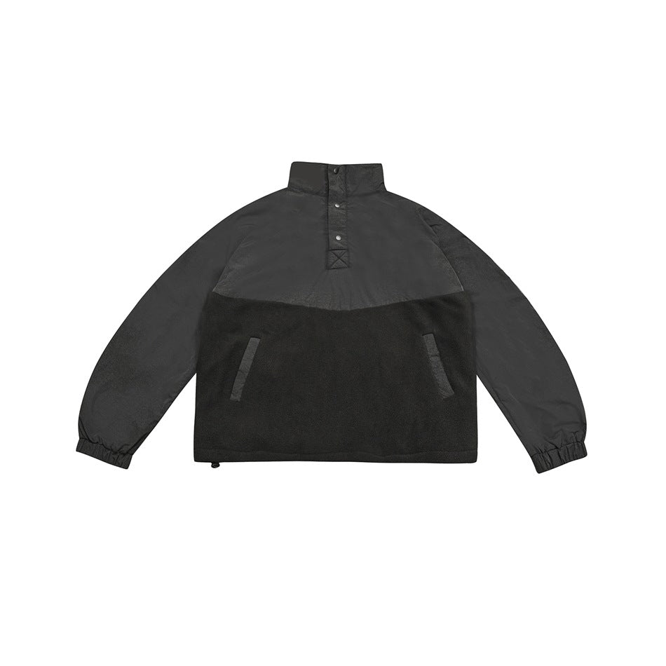 Gray-black stand-collar jacket flat lay with snap placket, fleece-like lower panel, front pockets and elastic cuffs