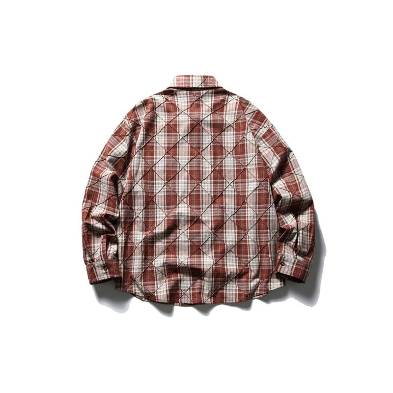 Back view of a rust red, cream, and gray plaid long-sleeve shirt with diamond stitching.