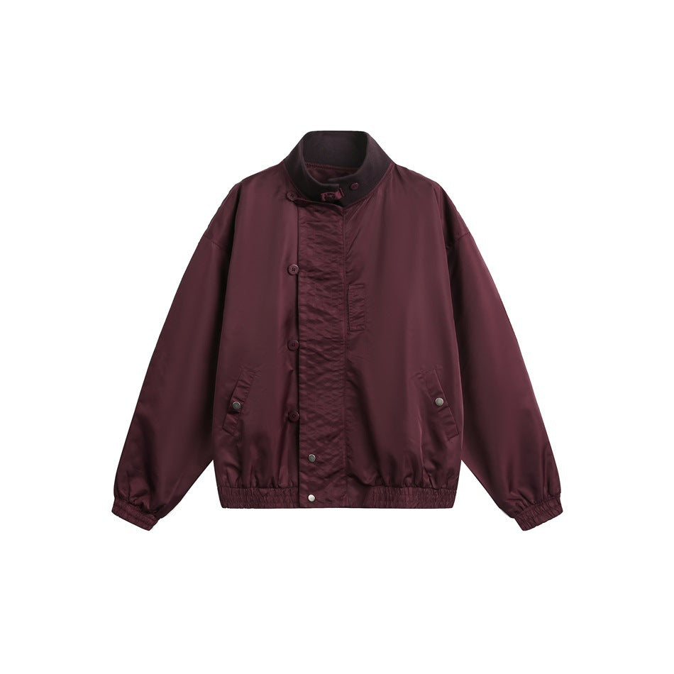 Burgundy stand-collar bomber jacket flat lay with an asymmetric button front, snap-flap pockets and elastic hem