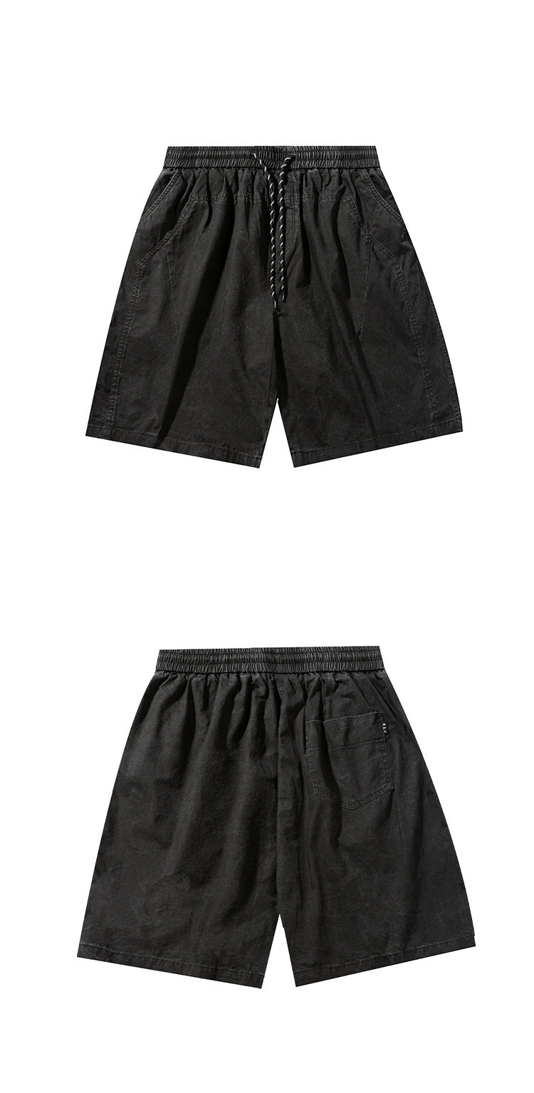 Black shorts shown flat from the front and back; the back view has a single pocket.