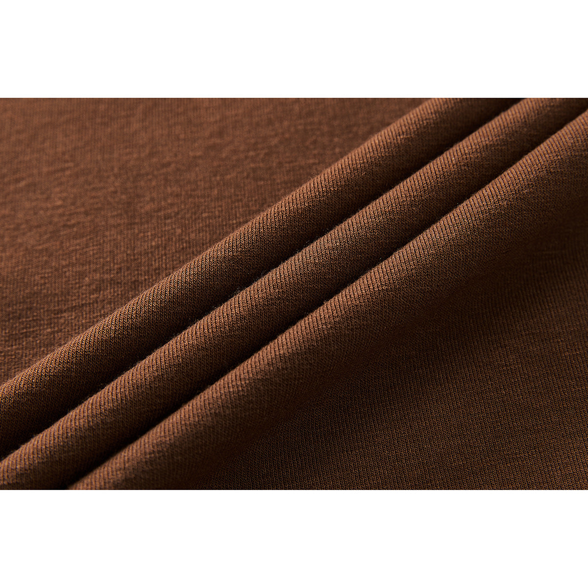 Macro view of brown heathered knit fabric draped in soft folds.