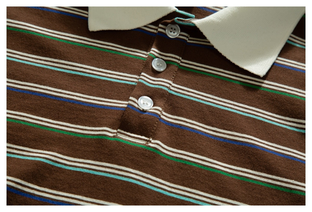 Close-up of a brown polo shirt's cream collar, three-button placket, and horizontal multicolor stripes.