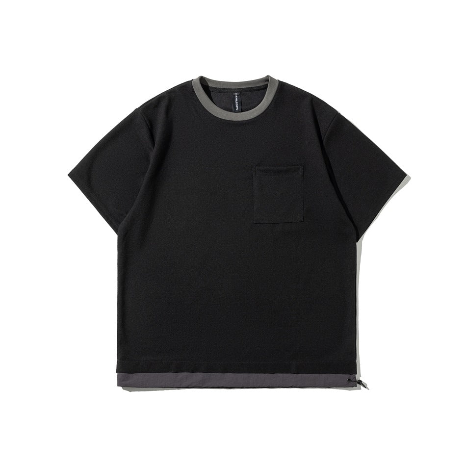 Front view of a black short-sleeve crew-neck T-shirt with gray neck trim, a chest pocket, and a contrasting hem panel.