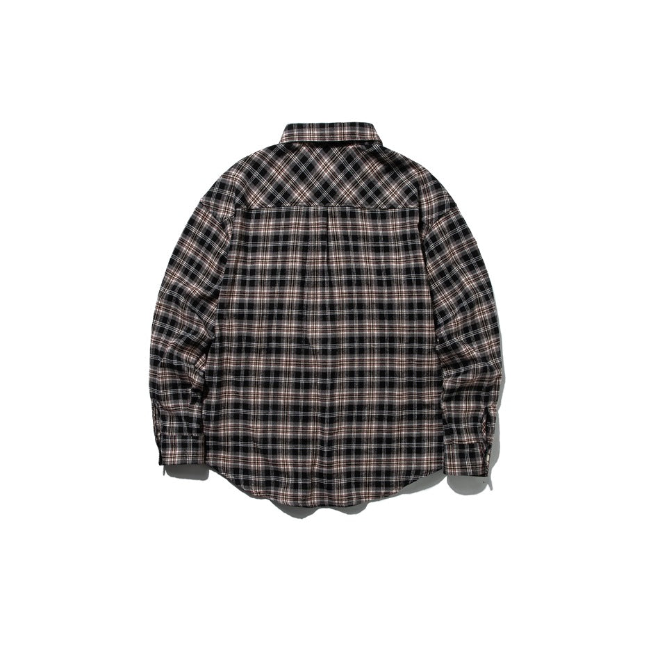 Back view of black and brown plaid long-sleeve shirt with a diagonal plaid yoke, flat lay