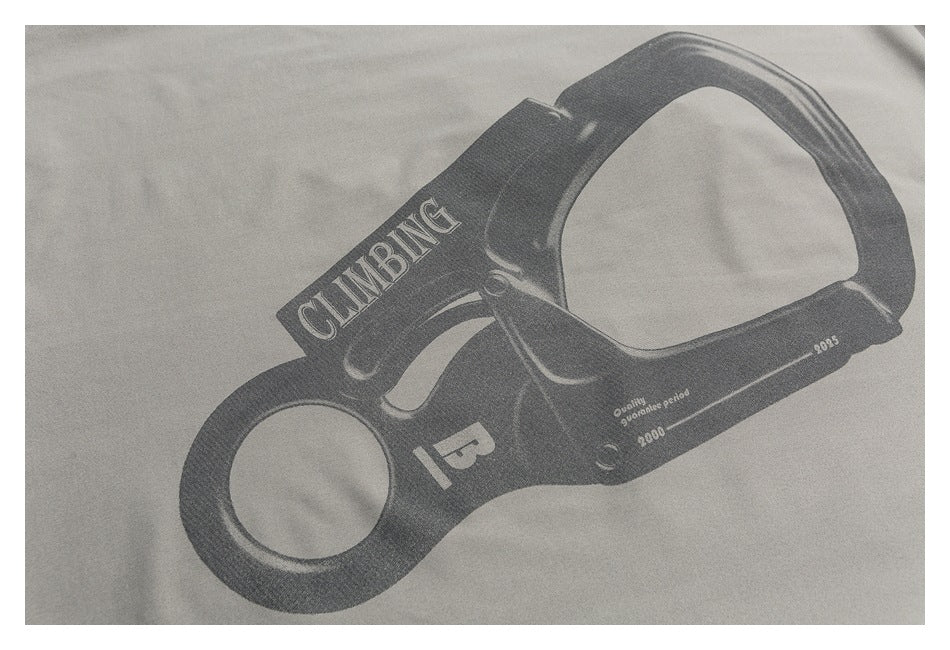 Close-up of a dark climbing-device graphic with English lettering printed on light gray fabric.