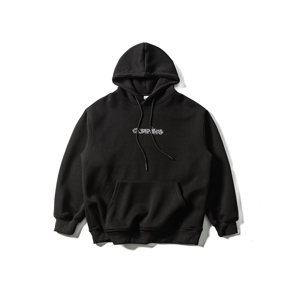 Black pullover hoodie laid flat, with drawstrings, a kangaroo pocket, ribbed cuffs and hem, and small white camping text on