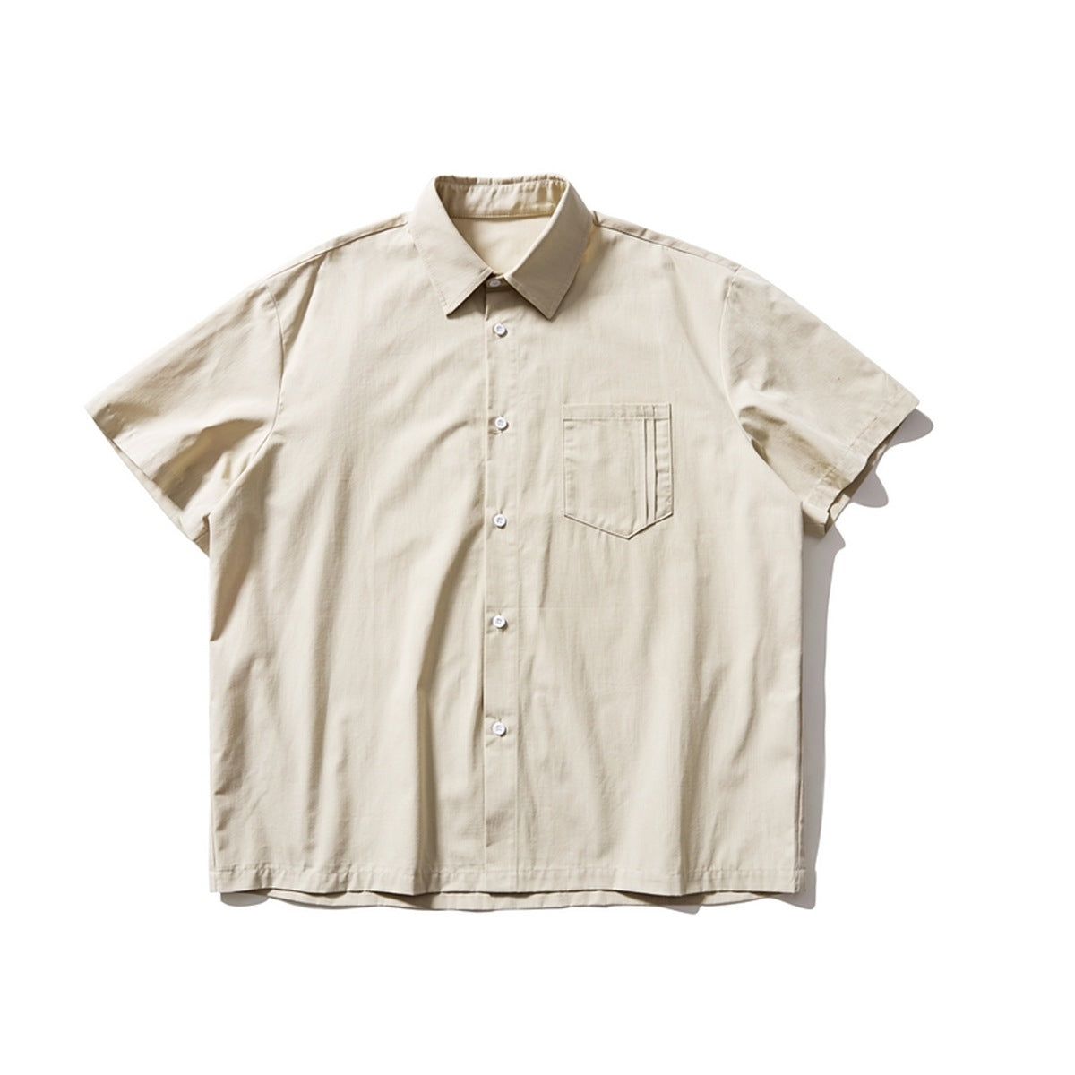 Beige short-sleeve button-front shirt with chest pocket, flat lay front view