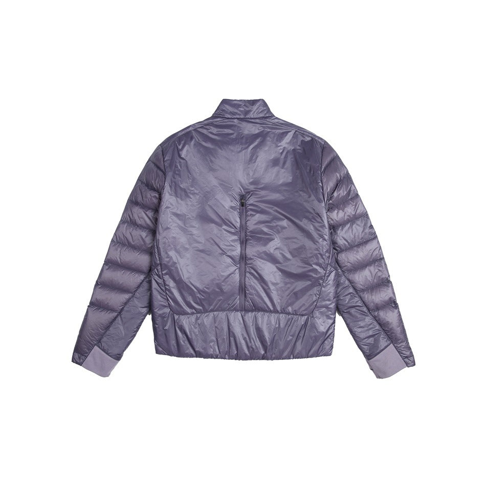 Back view of a lavender quilted jacket with a stand collar, center-back zipper, and elastic cuffs and hem.
