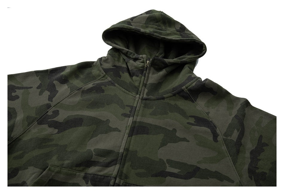 Cropped front view of a dark green camouflage zip hoodie with a hood and kangaroo pocket.