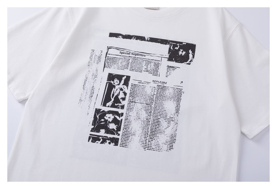 White T-shirt front with a large black newspaper-style graphic and small text and photo panels.