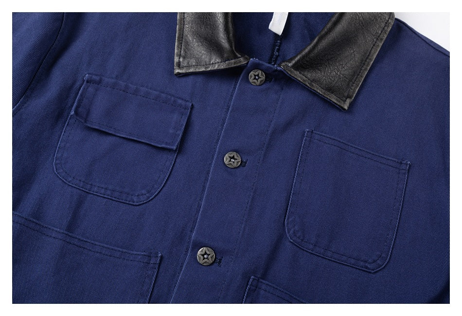 Close-up of the blue jacket's front patch pockets, black collar, and star-shaped buttons.