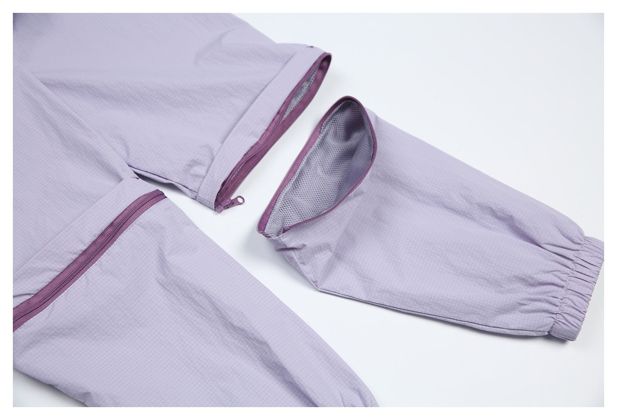 Close-up of lavender grid-patterned garment sections with plum zippers, gray mesh lining, and an elasticized cuff.