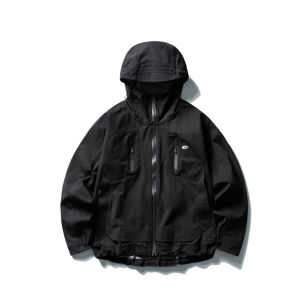 Black hooded zip jacket with zipped chest pockets, paneled sides and a curved layered hem, flat lay