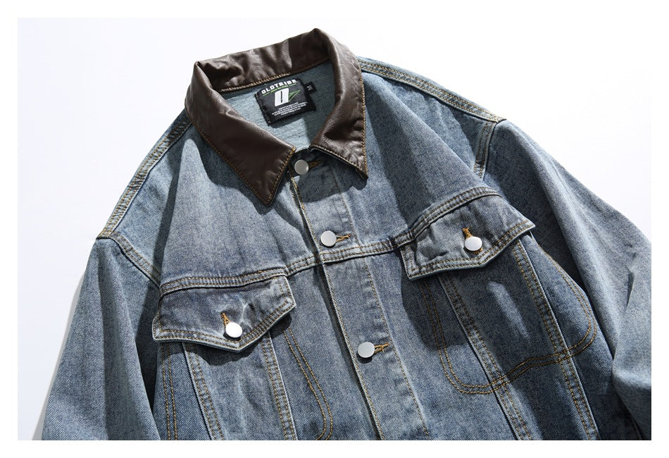 Front of a blue faded denim jacket with a dark brown collar, snap buttons, and flap chest pockets.