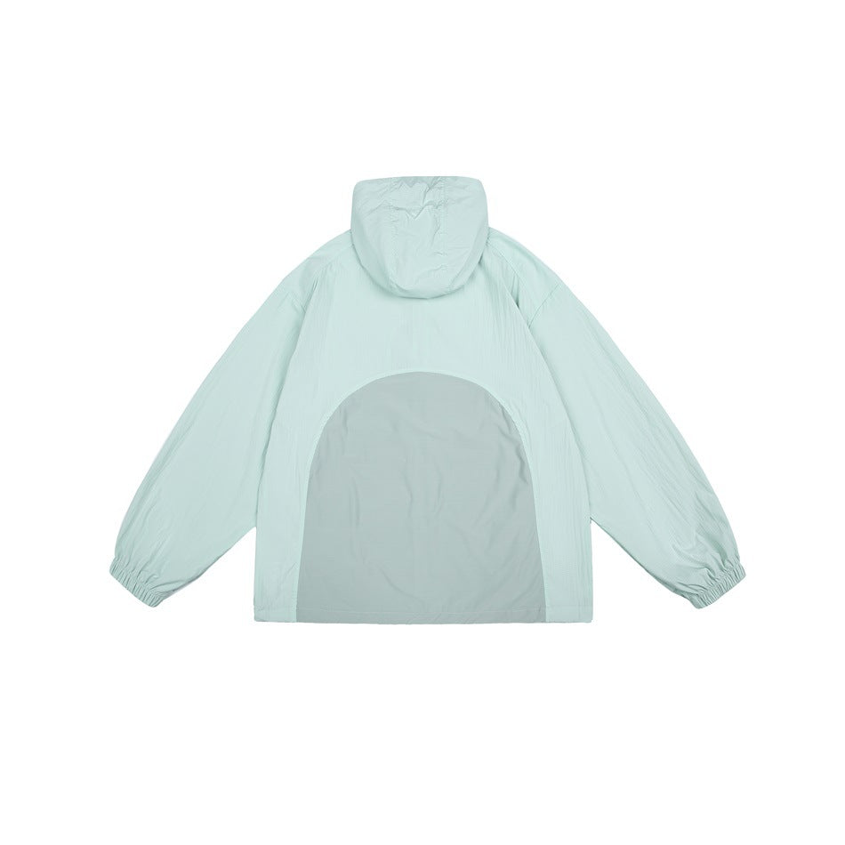 Back view of a pale mint hooded jacket with elastic cuffs and a large gray arched back panel.