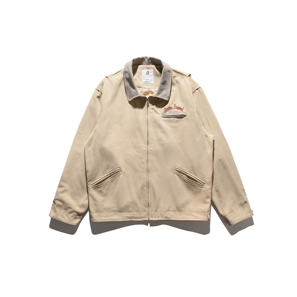 Khaki zip-front jacket with gray collar, chest zip pocket, embroidered lettering and two angled front pockets