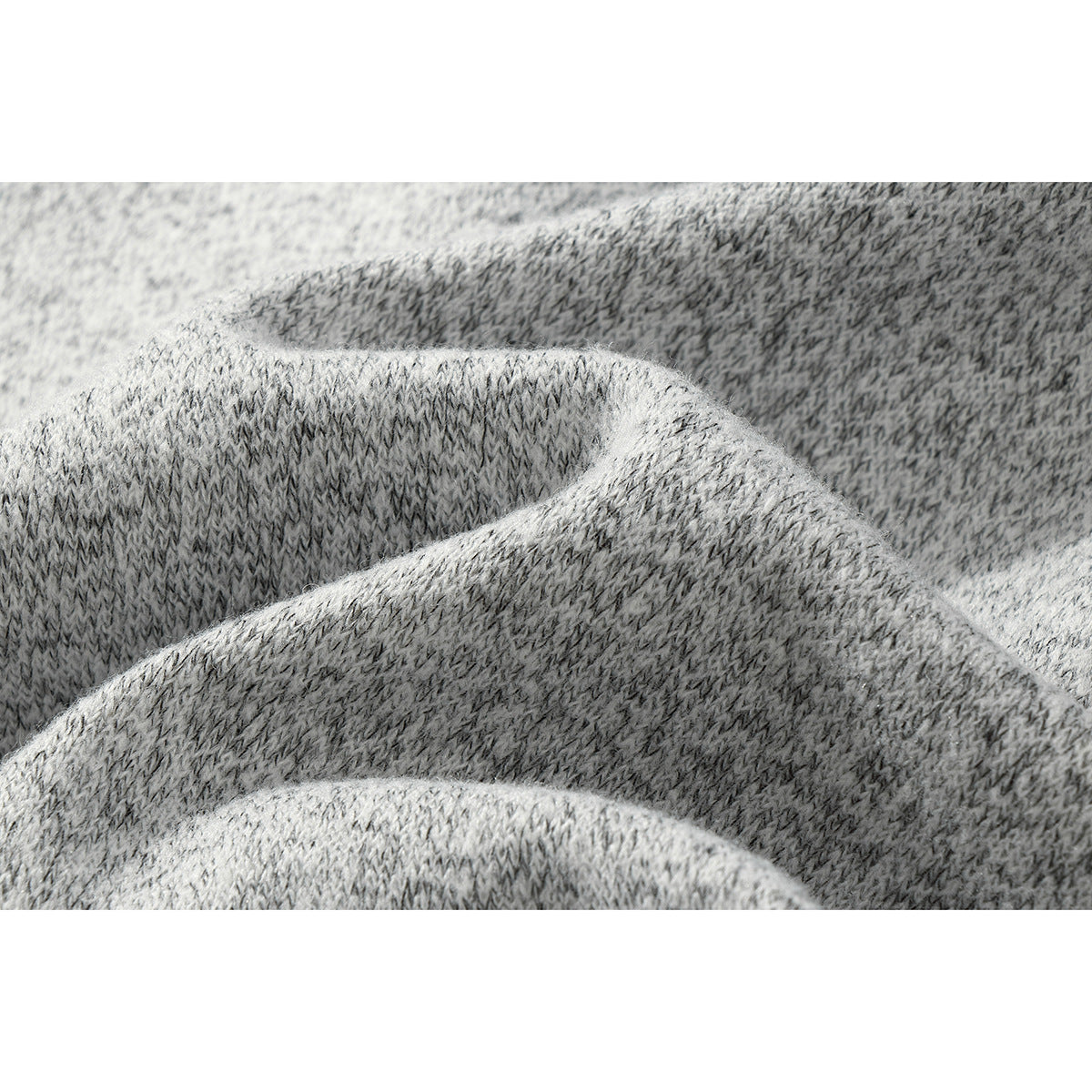 Macro view of the gray and charcoal marled knit texture.