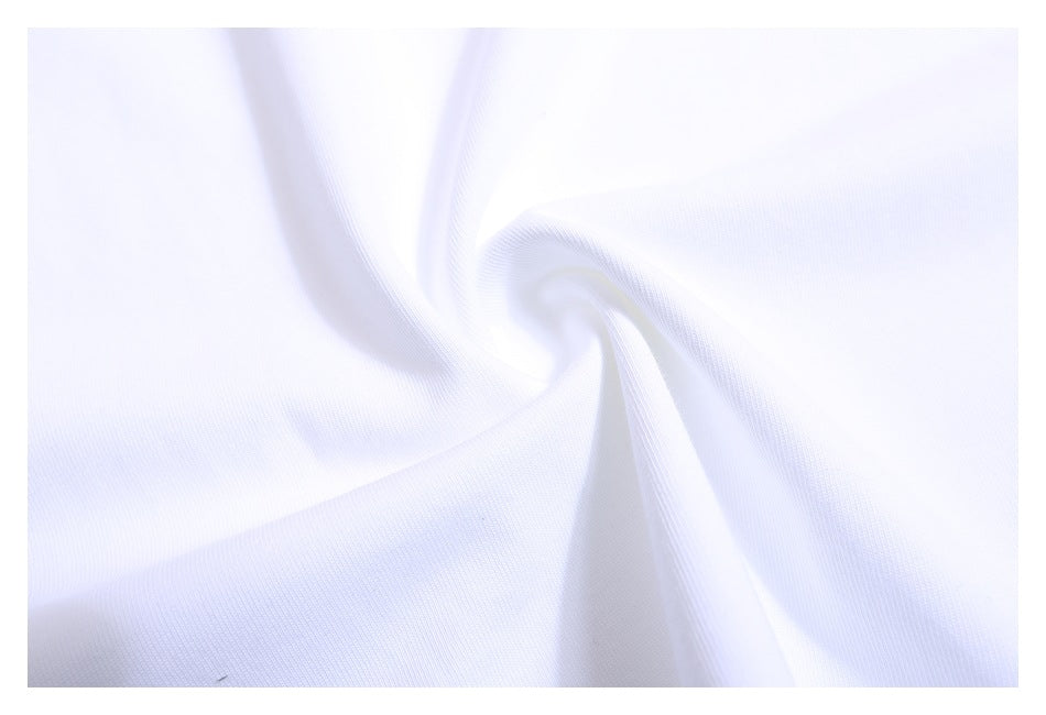 Close-up of smooth white fabric gathered into soft folds, showing a fine knit texture.