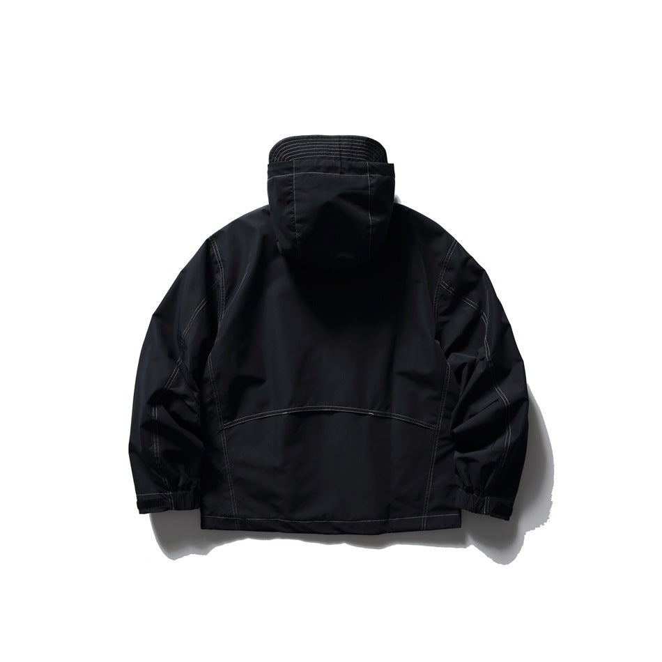 Back view of black hooded jacket showing curved back seam, contrast stitching and elasticated cuffs