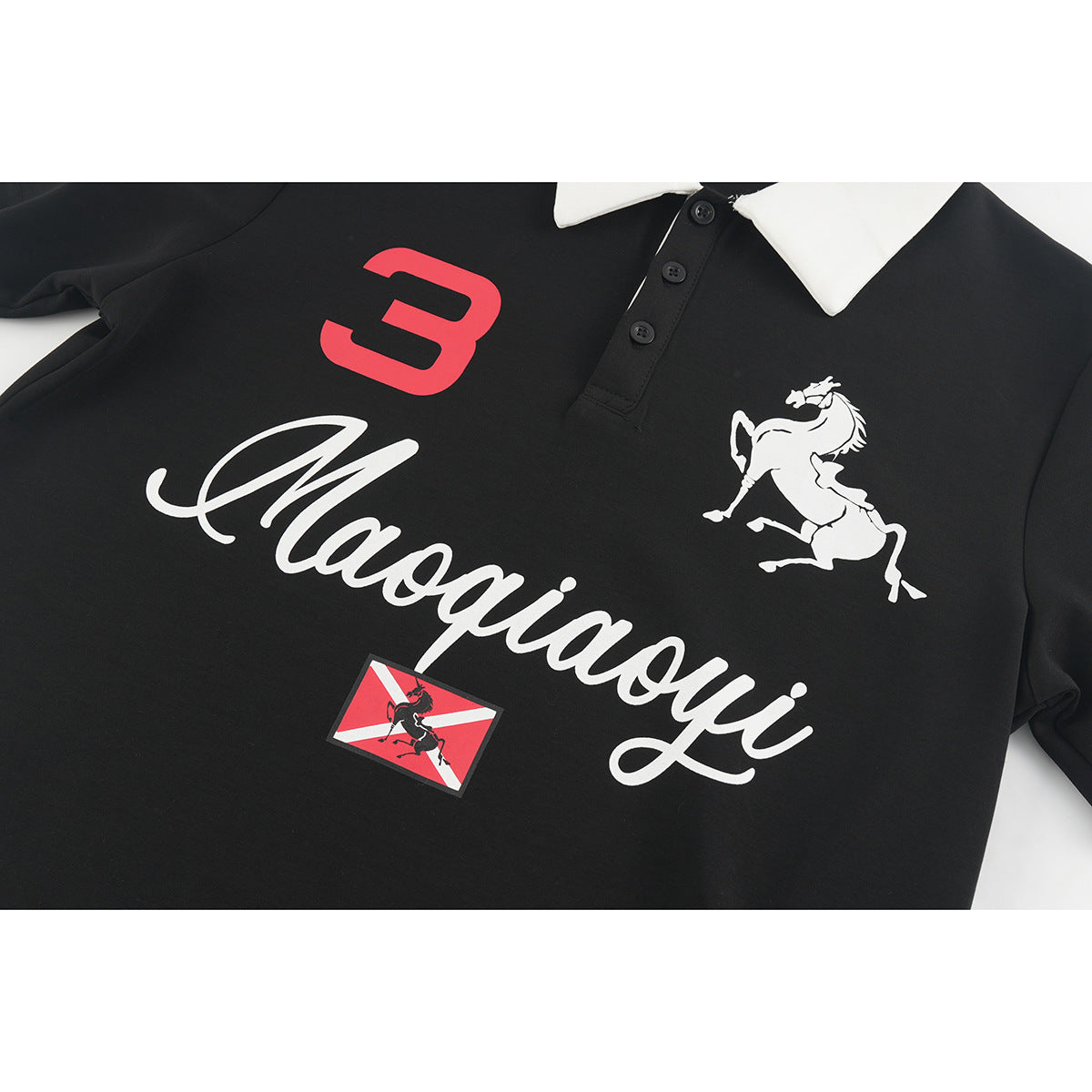 Close view of a black polo shirt with a white collar, red number 3, white horse graphic and script lettering.