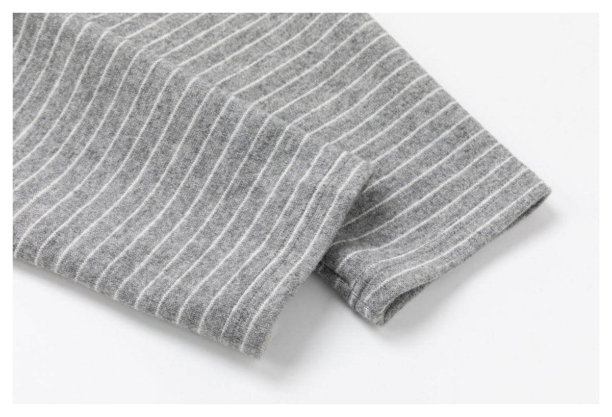 Close-up of the striped gray shirt sleeve and finished cuff.