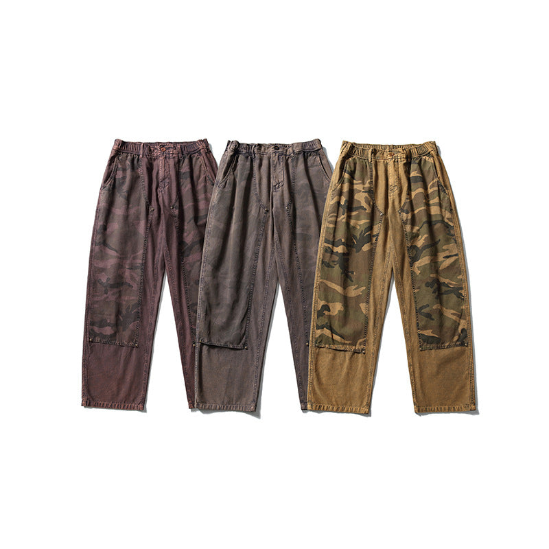 Three pairs of loose pants displayed front-facing in reddish-brown camouflage, gray-brown, and tan camouflage colorways.